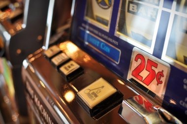 Treasures of Aztec slot game interface on mobile phone showing five reels and payline structure